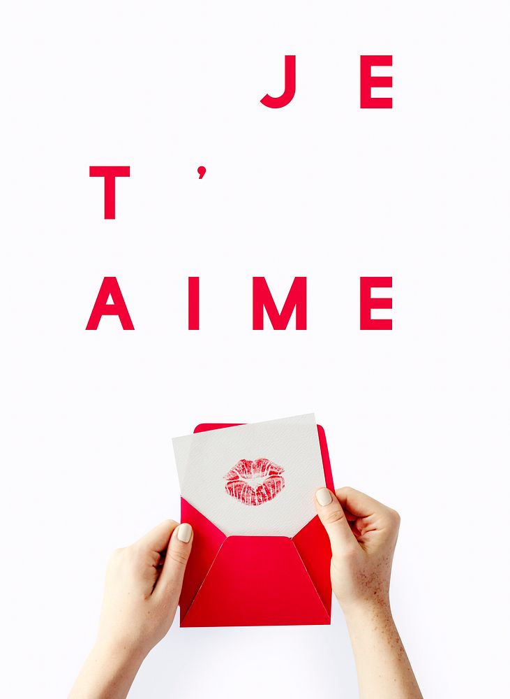 "Je T'aime" text over a woman holding a love letter