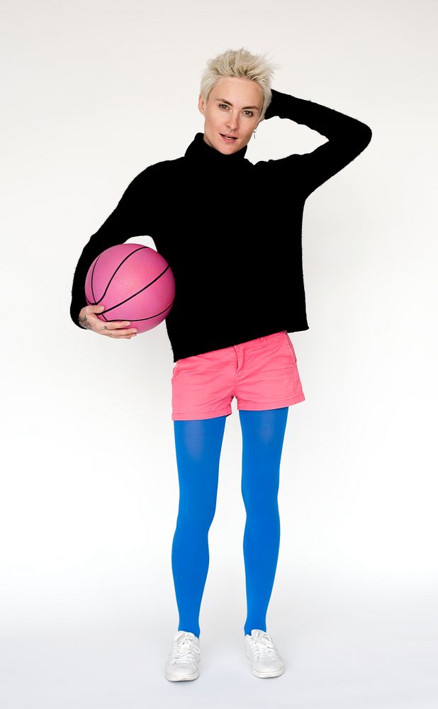 Portrait of a woman with a pink basketball