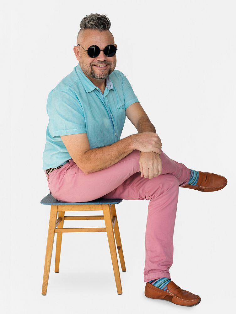 A Man with Sunglasses Sitting on a Chair