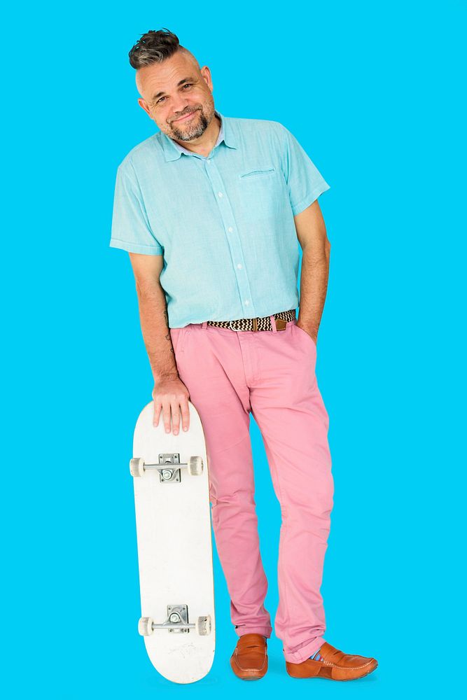 A Man Standing Holding Skateboard