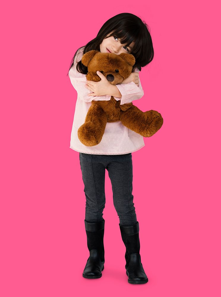 Little Girl Hugging Teddy Bear