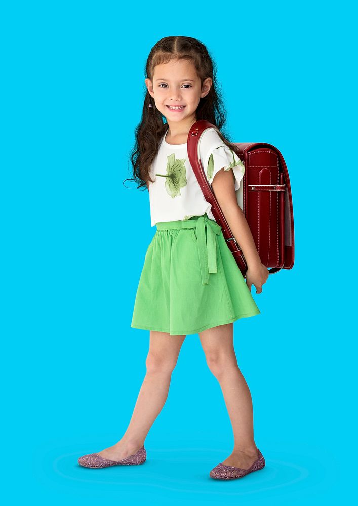 A girl smiling with a school backpack
