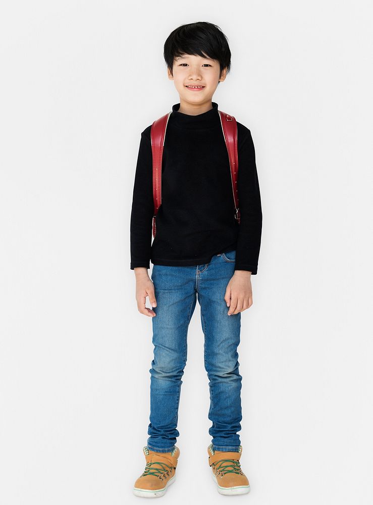 Young asian kid student with a backpack full body portrait