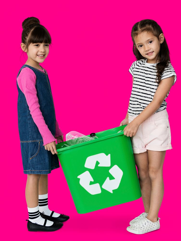 Two girls are holding a recycle bin