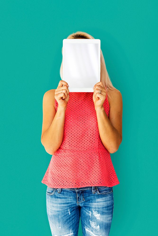 Woman holding tablet cover her face