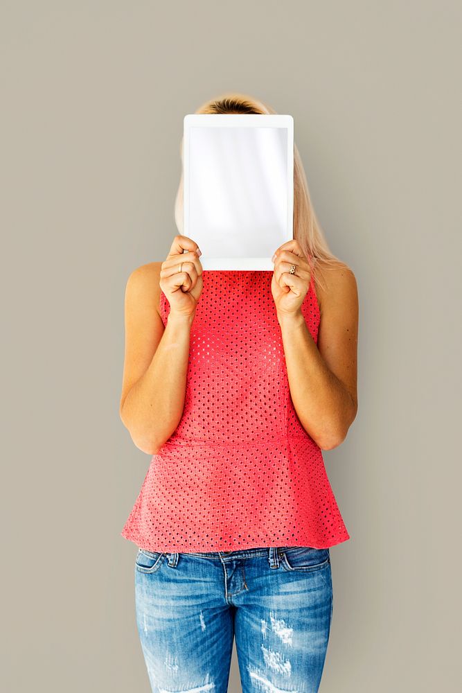 Woman holding tablet cover her face