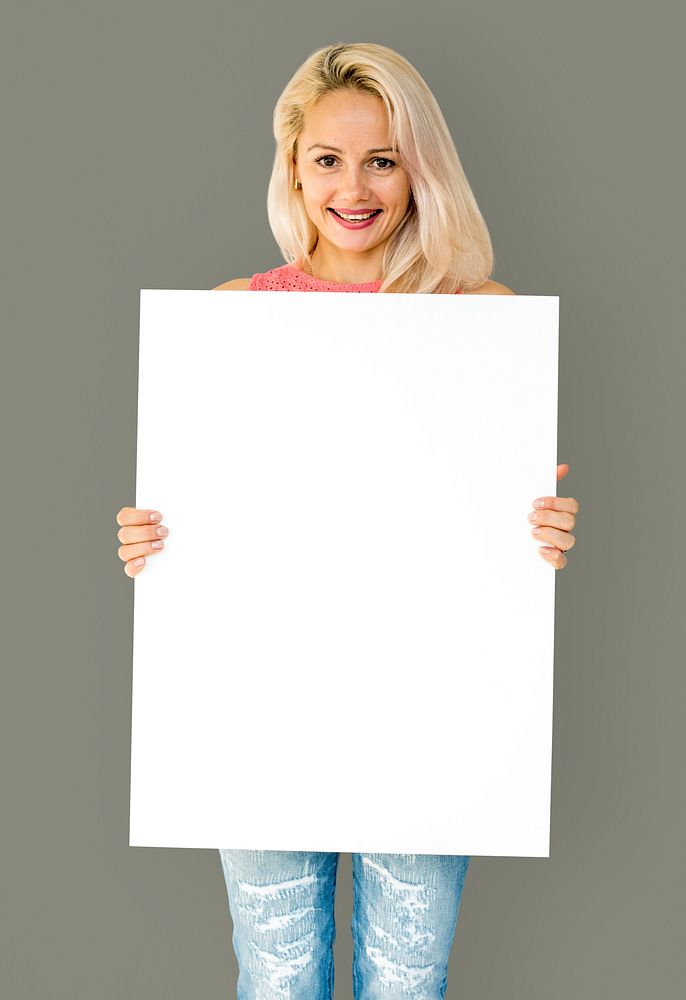 Woman holding empty board for advertsiting
