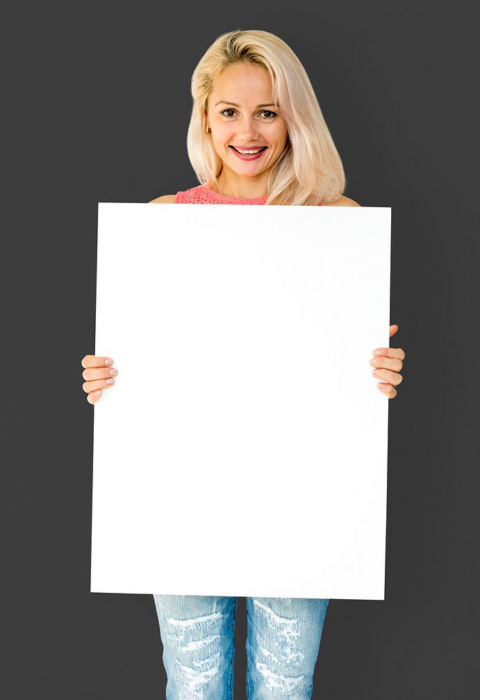 Woman holding empty board for advertsiting