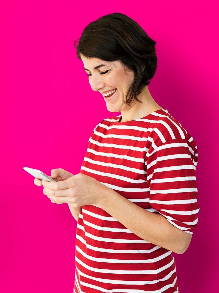 Adult Woman Using Mobile Phone Cheerfully