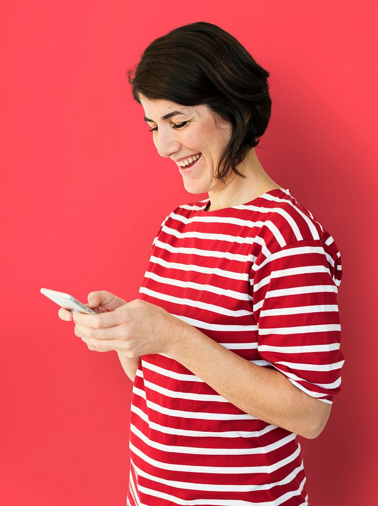 Adult Woman Using Mobile Phone Cheerfully