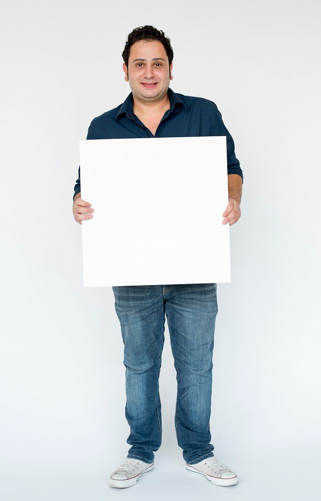 Adult Man holding Blank Paper Board Copy Space Studio Portrait