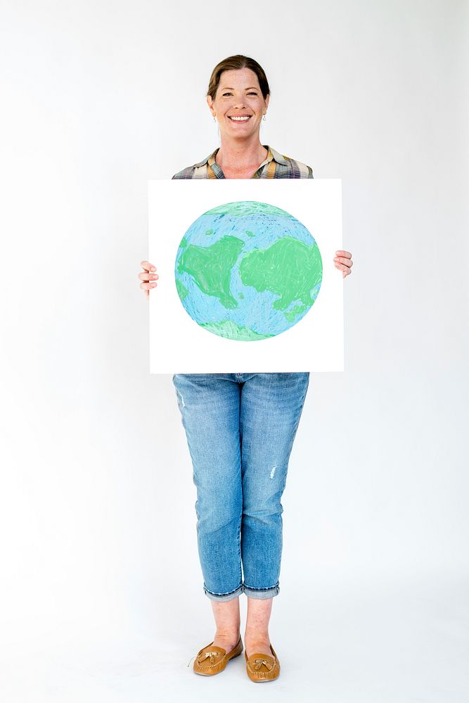 Cheerful woman showing poster with globe