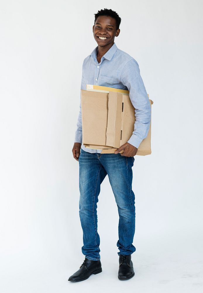 Man holding cardboard and posing for photoshoot