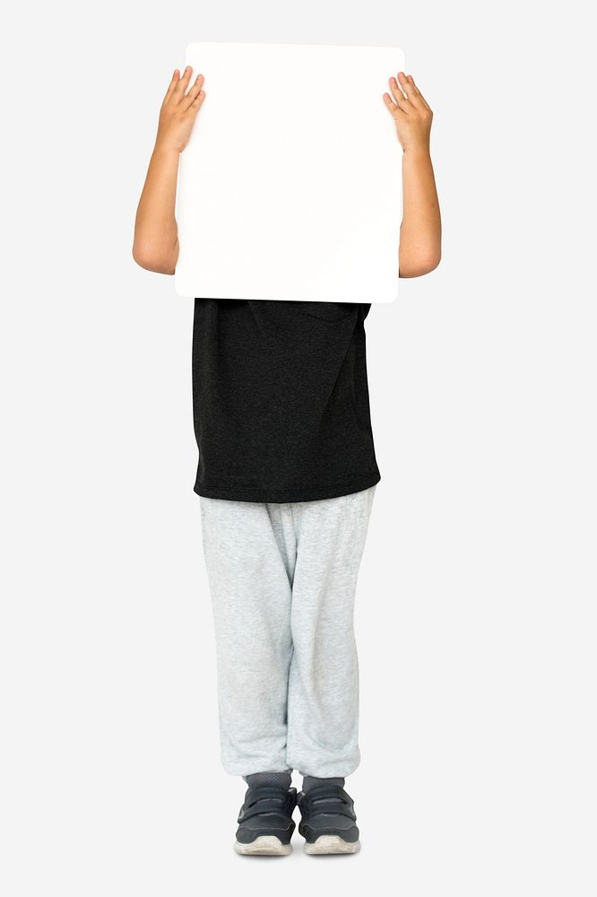 Little boy holding blank placard covering his face