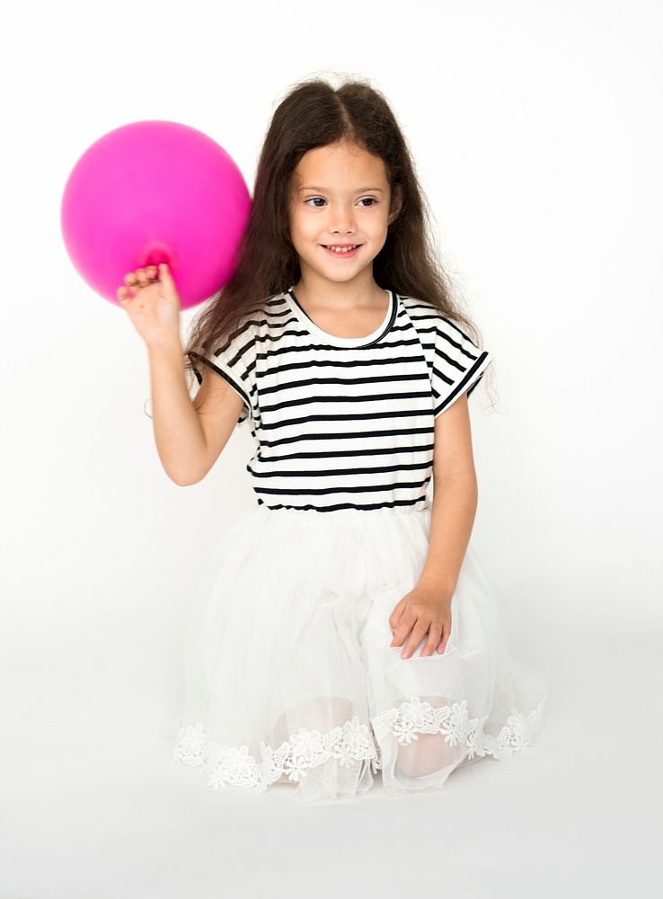 Kid happiness with balloon on studio shoot