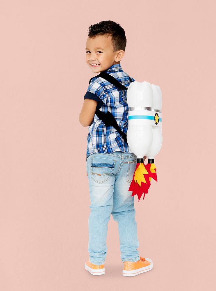 Little Boy With Toy Rocket on The Back