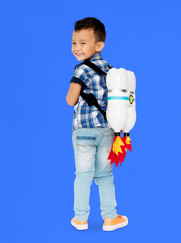 Little Boy With Toy Rocket on The Back