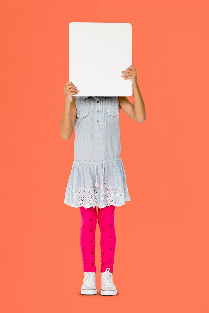 Little girl holding blank placard covering her face
