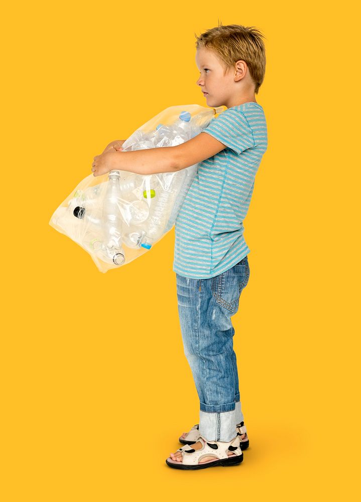 Ecology little boy holding bag of plastic bottle for recycle