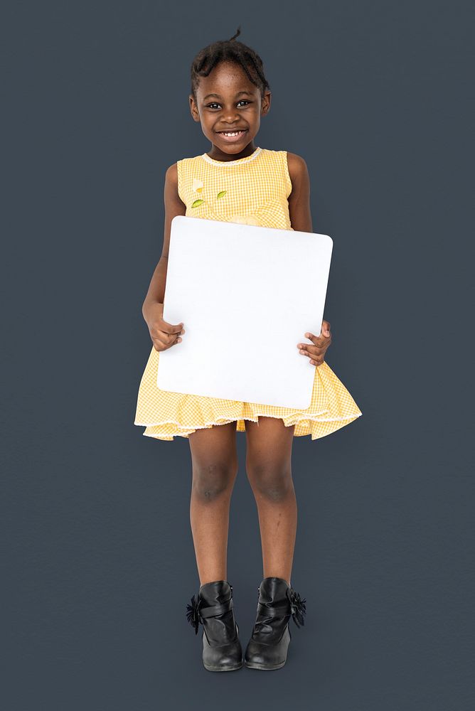 African little girl holding blank placard studio portrait