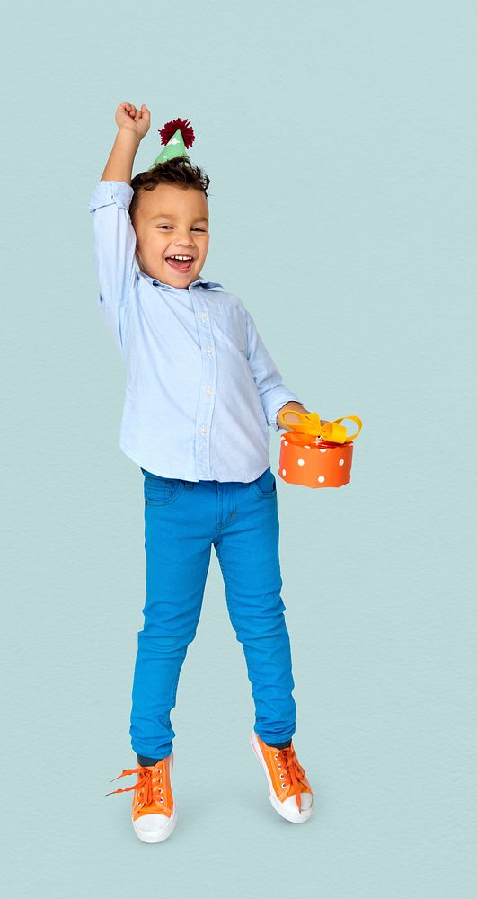 Little Boy with Gift Party Hat Studio Portrait