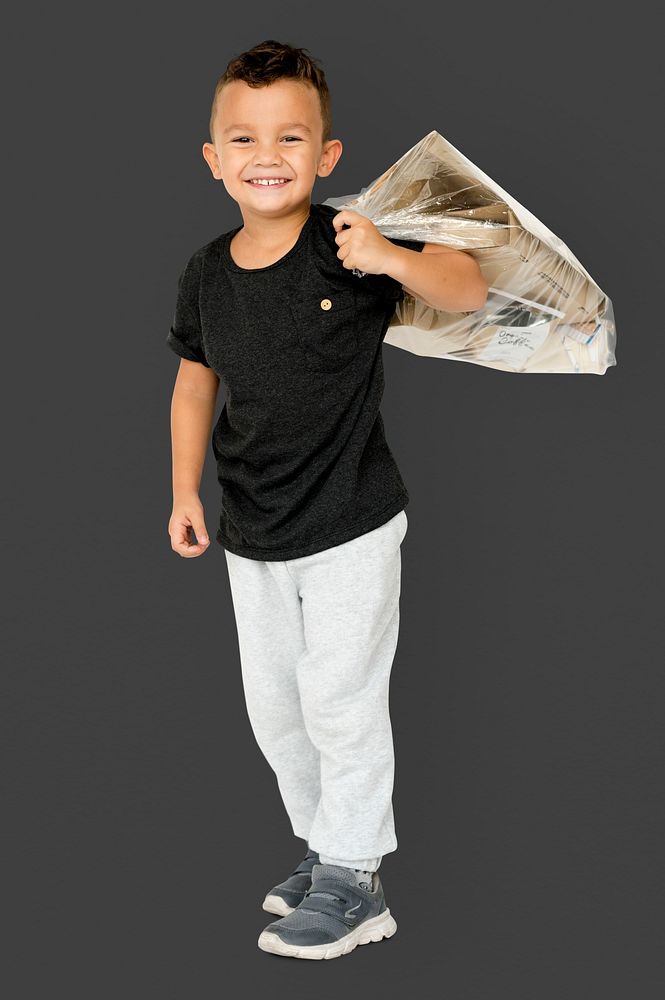 Little Boy Holding Separate Papers Studio Portrait