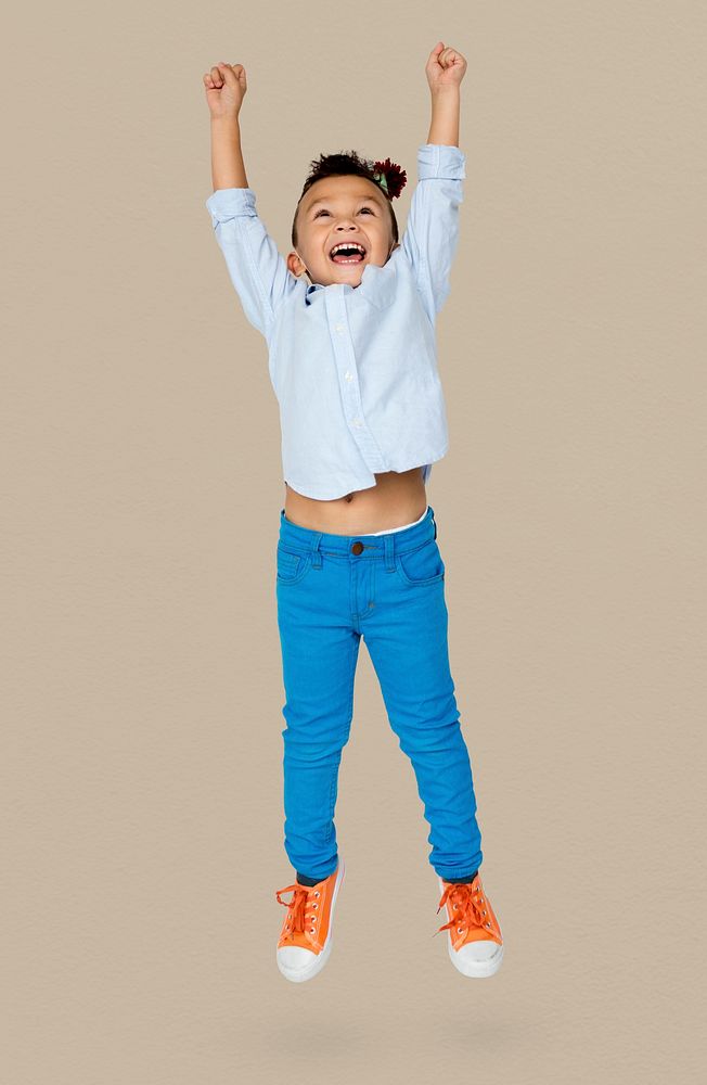 Little Boy Junping Enjoy Happiness Cheerful Studio Portrait