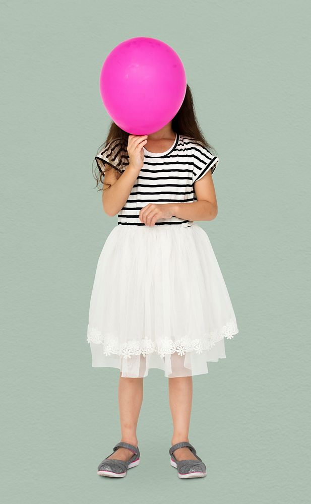 Young is holding pink balloon cover her face