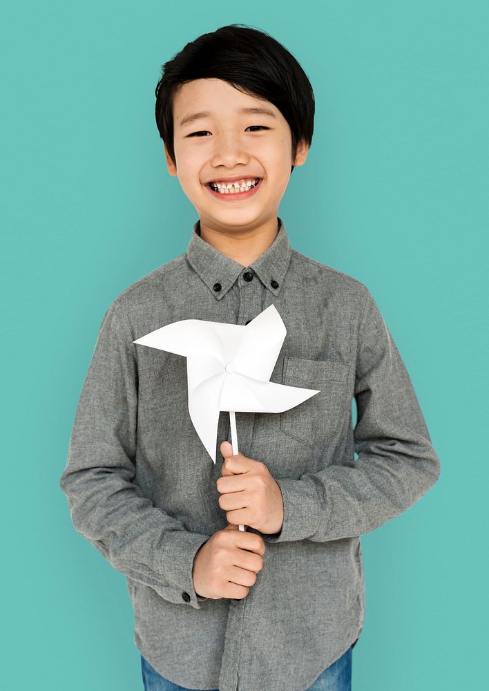 Little Boy Hands Holding Paper Wind Mill Studio Portrait