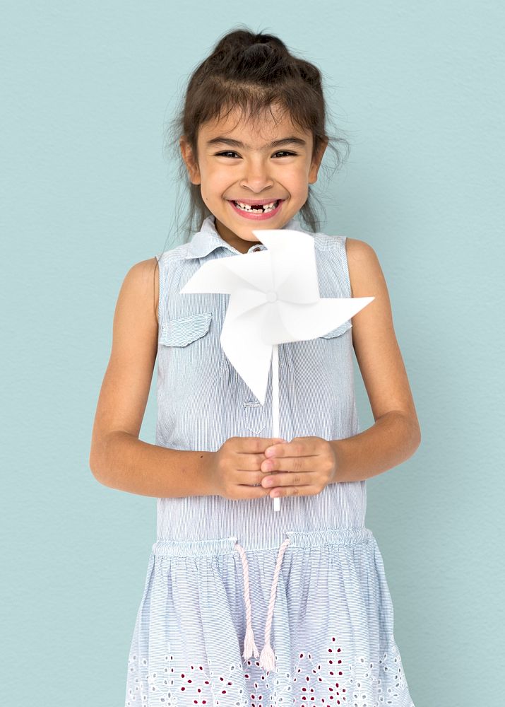 Little Girl Hands Holding Paper Wind Mill Studio Portrait
