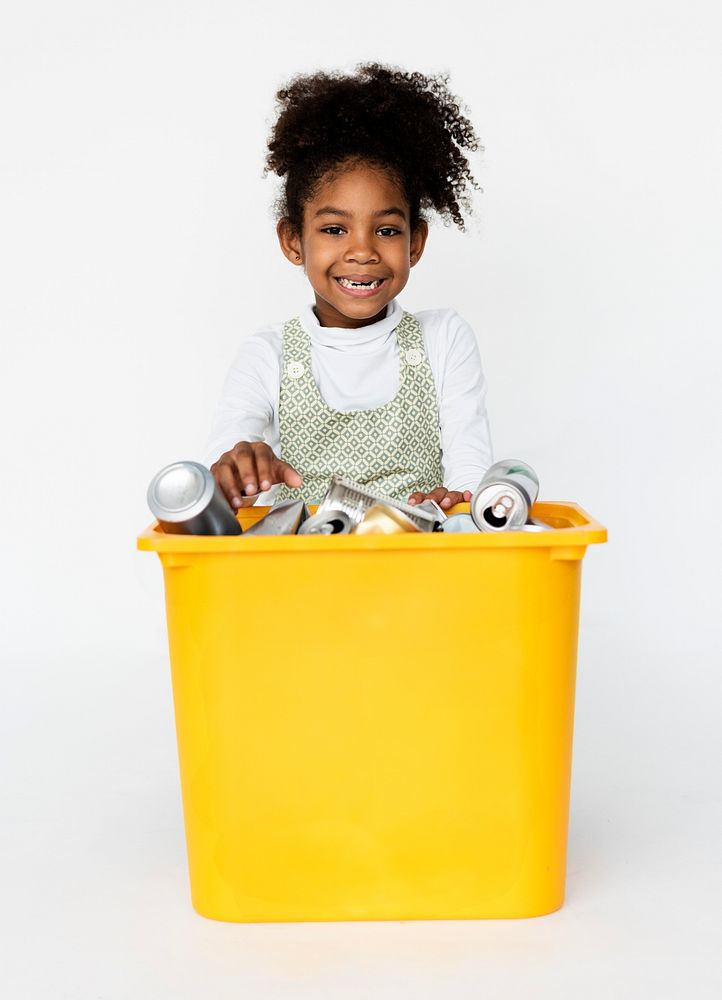 African kid with a trash for recycle