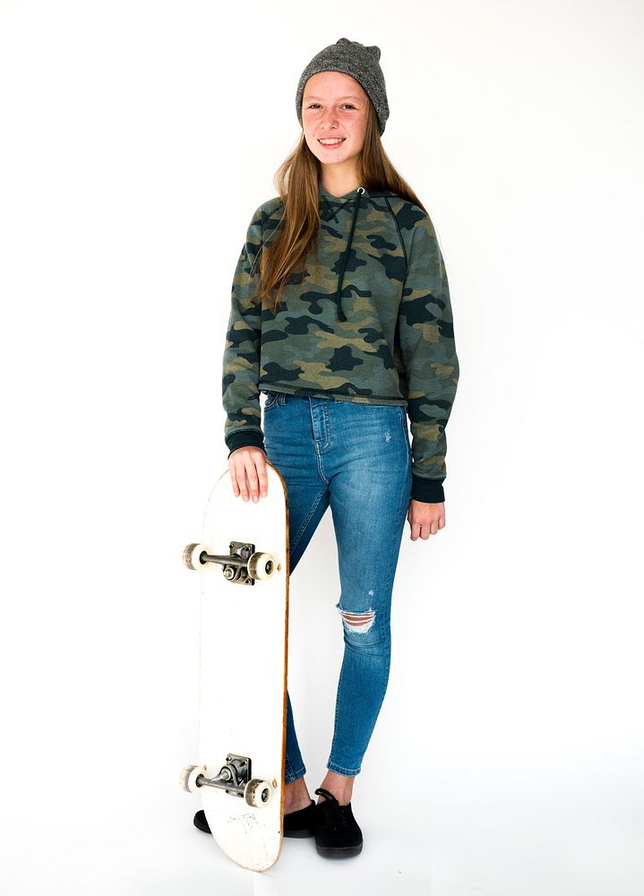 A Young Girl is holding Skateboard