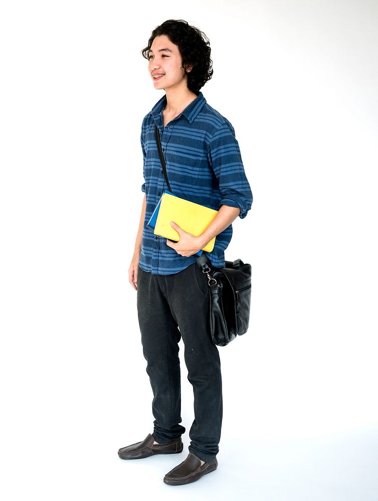 Young student boy holding school textbook