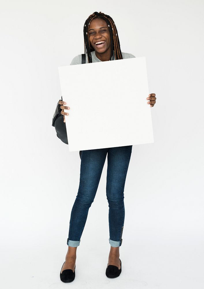 African girl holding blank banner studio portrait