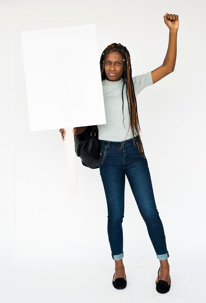 African girl holding blank banner studio portrait