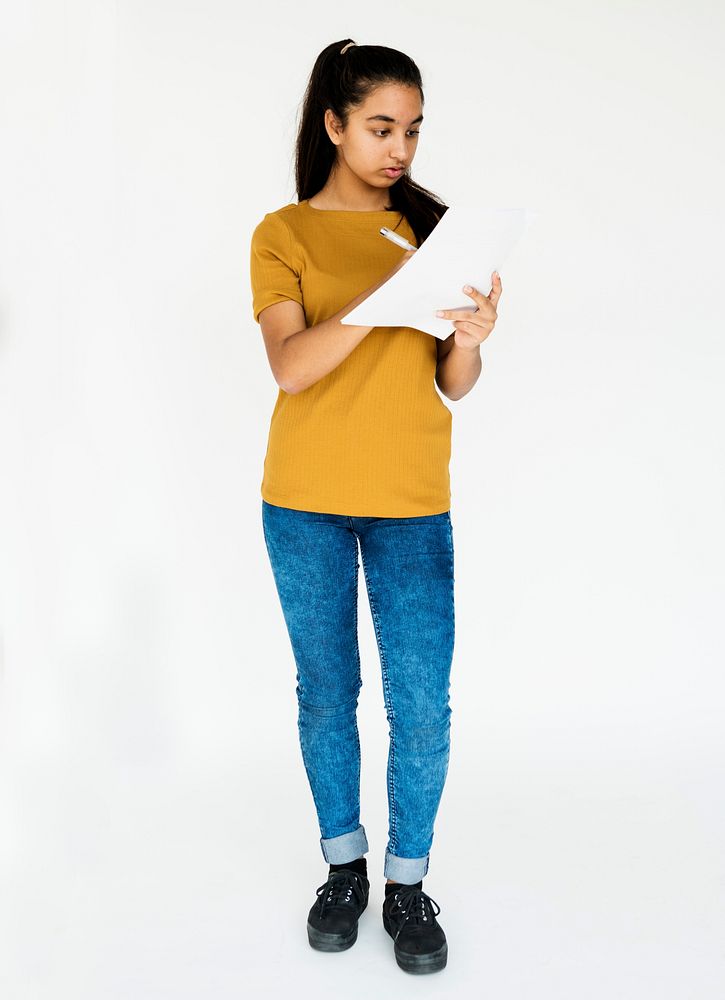 Young adult girl writing lecture casual studio portrait