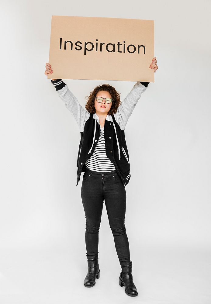 Woman holding and showing the inspiration board