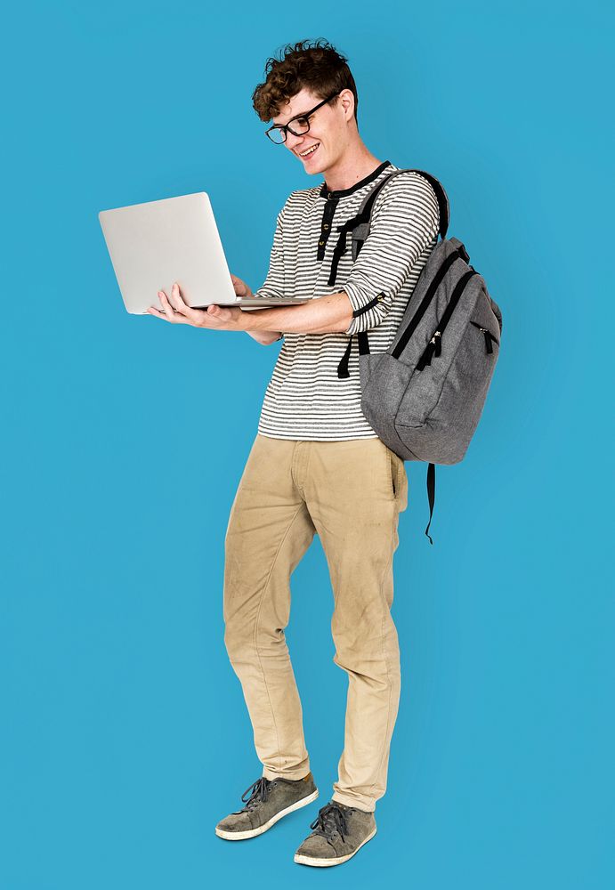 Young man standing using laptop connection