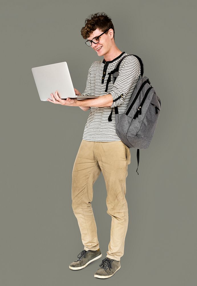 Young man standing using laptop connection