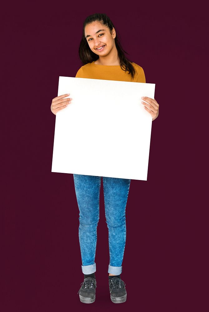 Indian Ethnicity Smiling Girl Standing and Holding Placard