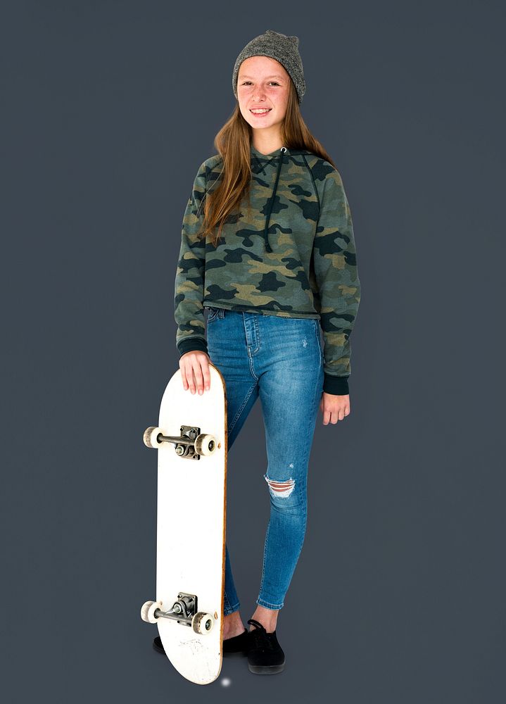 Young student girl standing with skateboard