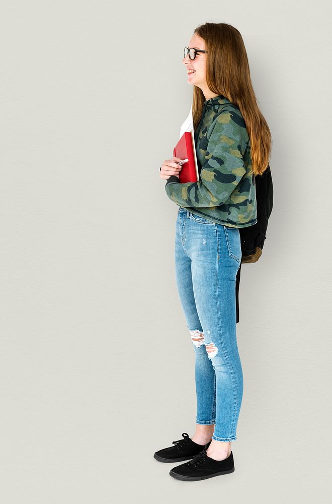 Young Adult Holding Books and School Bag Studio Portrait