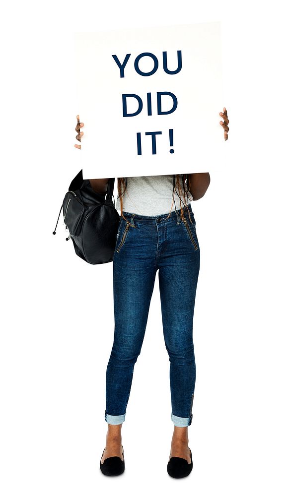 Woman holding banner with the phrase "You did it!"