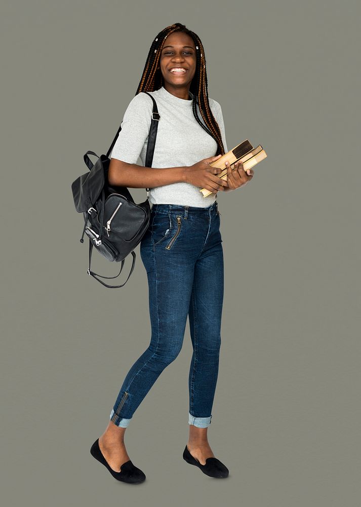 African girl student smiling and holding textbook