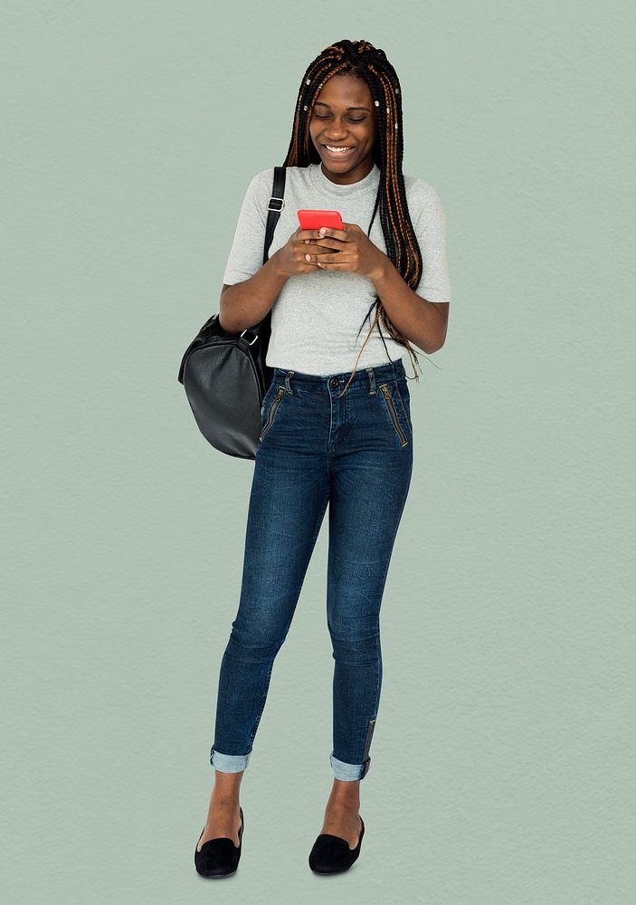 African girl smiling and using mobile phone