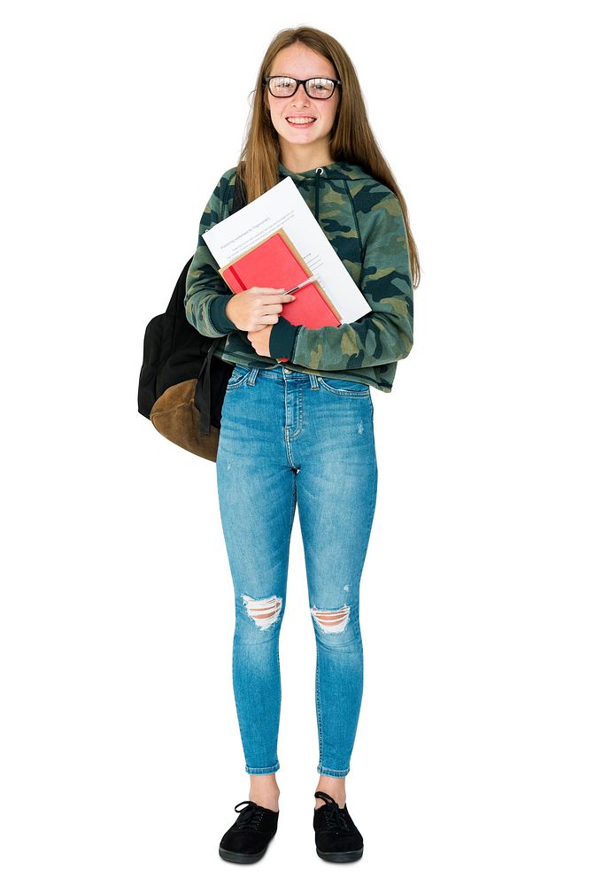 Teenage girl student smiling and holding textbook