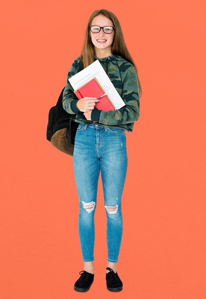 Teenage girl student smiling and holding textbook