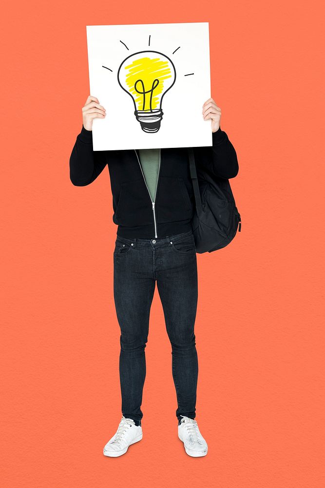 Man holding banner with light bulb symbol cover his face