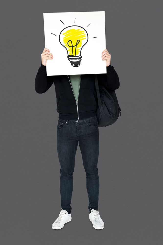 Man holding banner with light bulb symbol cover his face