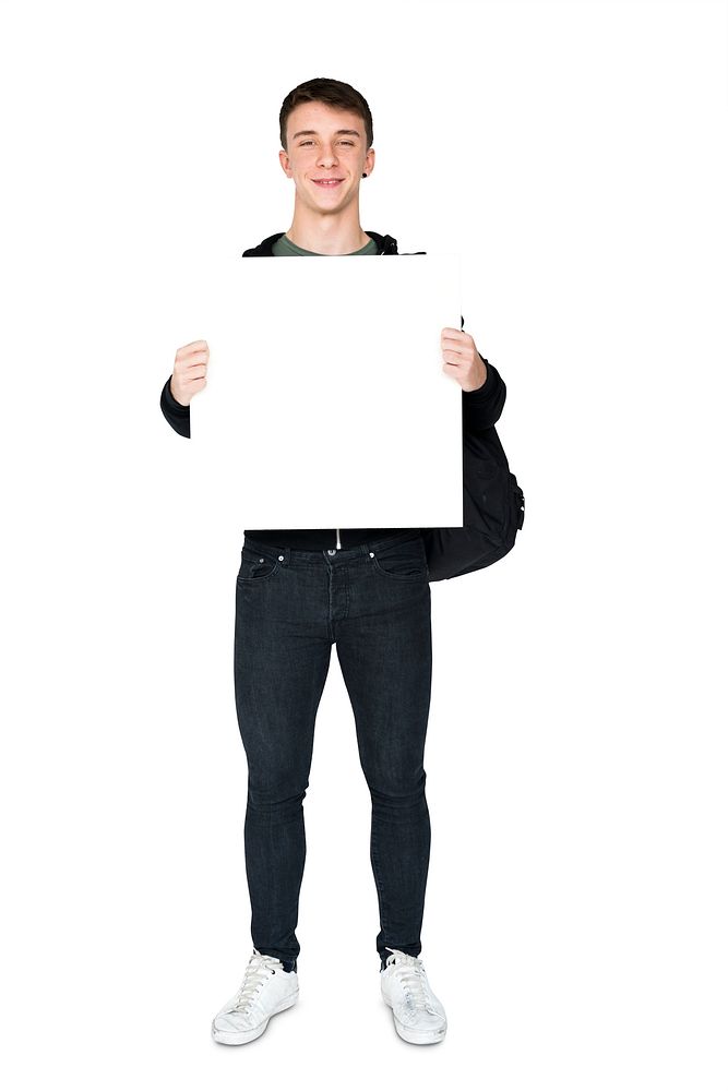 Young adult man holding blank banner
